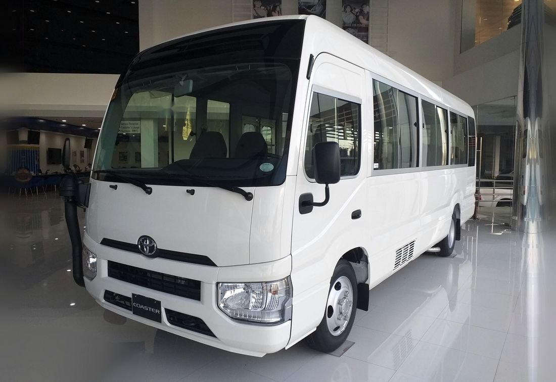 White Toyota Coaster mini coach