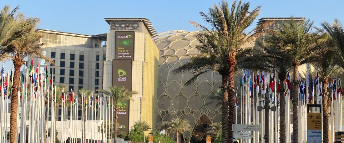The Al Wasl dome and flag avenue at Expo City Dubai at golden hour