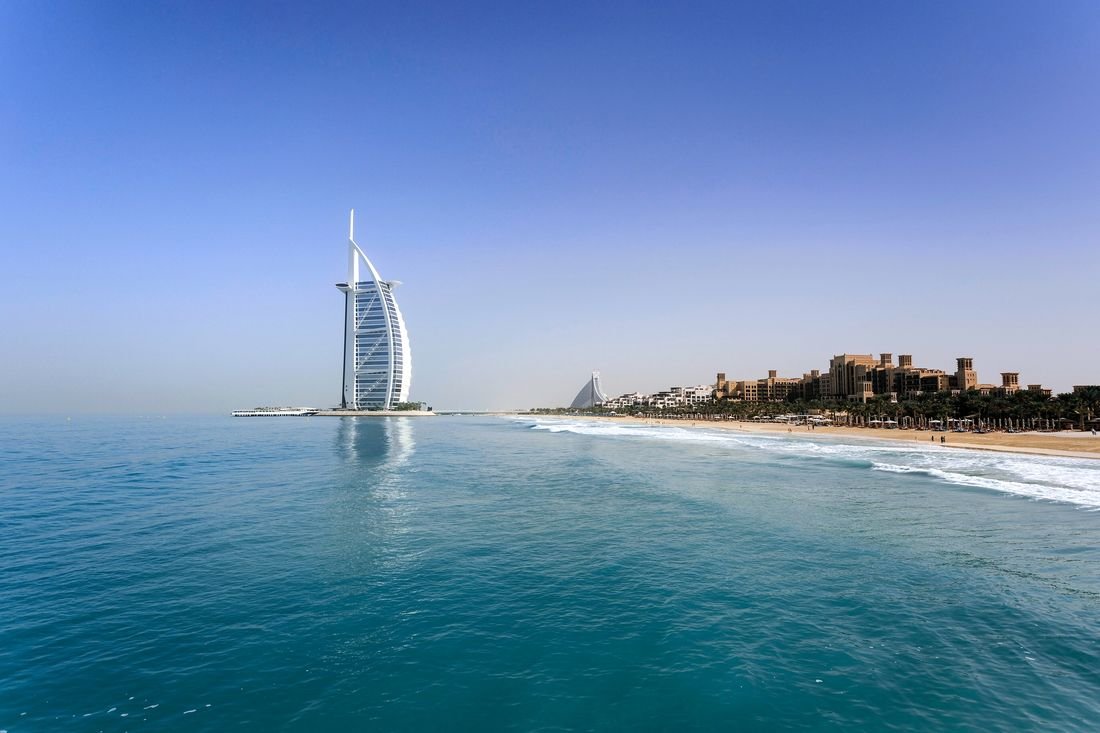 The Burj Al Arab and the Jumeirah beachfront under a clear sky